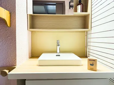 a bathroom with a sink and a cup on a counter at Le Nid du Mont Joly, Mountain View et Parking in Saint-Gervais-les-Bains