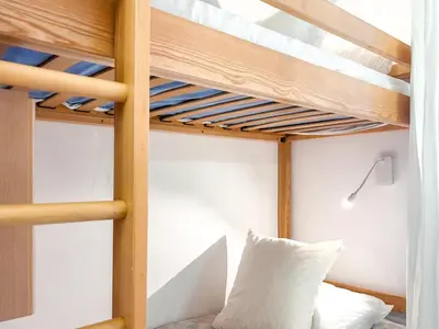 a bunk bed in a bedroom with a bunk bedutenewayewayprefixprefixprefix at Grand studio Flaine Forum vue montagne in Flaine