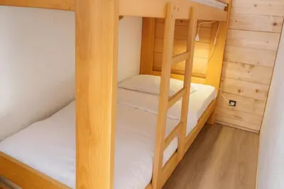 a bunk bed room with two bunk beds in it at Bright apartment with views of Mont Blanc in Chamonix-Mont-Blanc