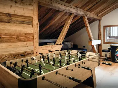 a large wooden billiard table in a room at Chalet Trumont - OVO Network in Samoëns