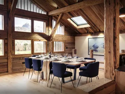 a dining room with a table and chairs at Chalet Trumont - OVO Network in Samoëns