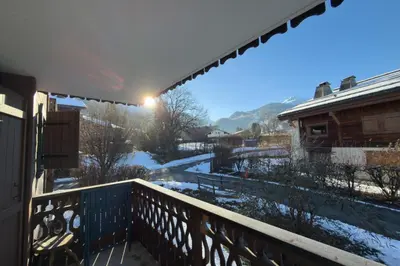a view of a balcony with snow on the ground at Cozy apartment in Saint-Gervais-les-Bains in Saint-Gervais-les-Bains
