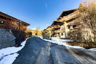 an empty street with snow on the ground at Cozy apartment in Saint-Gervais-les-Bains in Saint-Gervais-les-Bains