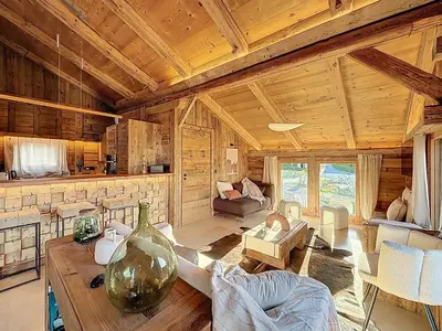 a living room with a large vase on a table at Chalet 5 chambres + dortoir proche pistes Combloux - FR-1-560-173 in Combloux