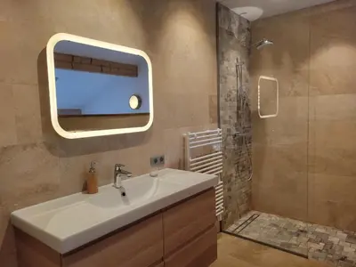 a bathroom with a sink and a shower at Lechappee Valleenne in Saint-Gervais-les-Bains