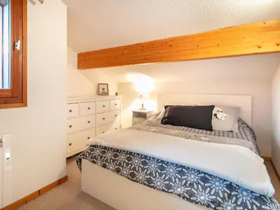 a bedroom with a bed and a dresser at Gelinotte N51 4P6 in Morillon