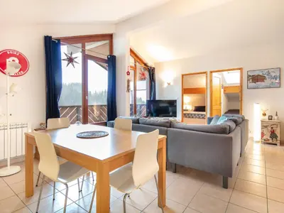 a living room with a table and a couch at Gelinotte N51 4P6 in Morillon