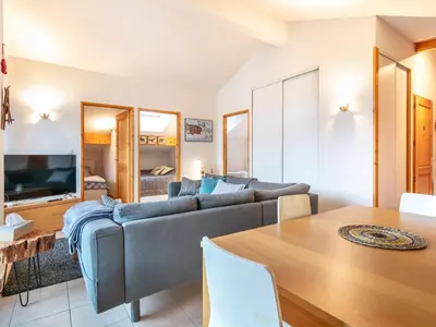 a living room with a couch and a table at Gelinotte N51 4P6 in Morillon