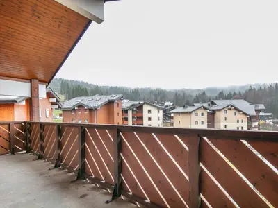 a balcony with a view of a city at Gelinotte N51 4P6 in Morillon