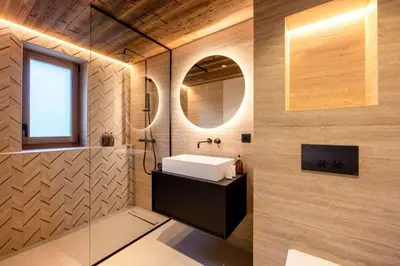 a bathroom with a sink and a mirror at Chalet Les Sapins - Megève in Megève