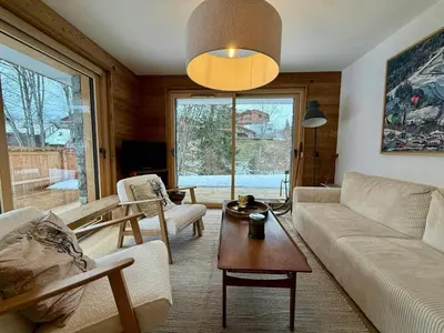 a living room with a couch and a table at Apartment With Nordic Bath In Les Carroz in Les Carroz d'Araches