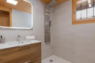 a bathroom with a sink and a shower at Chalet de Nina in Les Houches