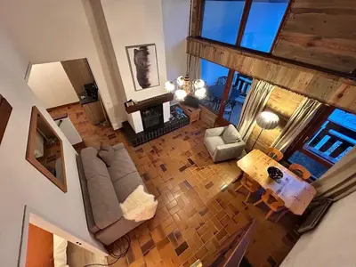 an overhead view of a living room with a couch and a table at Chalet des Cinq in Samoëns