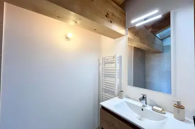 a bathroom with a sink and a mirror at Comfortable stay 200m from the ski lifts in Combloux