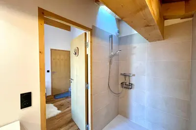 a bathroom with a shower and a walk in shower at Comfortable stay 200m from the ski lifts in Combloux