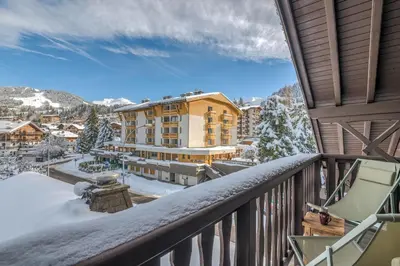 a view from the balcony of a hotel in the snow at Appartement La musardière - Welkeys in Megève