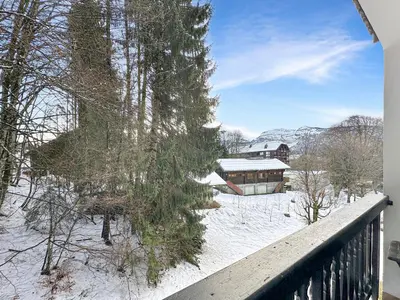 a view from a balcony of a house in the snow at OEI30 - 3 pieces 6 pers proche centre station in Les Carroz d'Araches