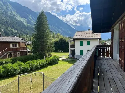 an empty hallway with a rug on the floor at La Flégère YourHostHelper in Chamonix-Mont-Blanc
