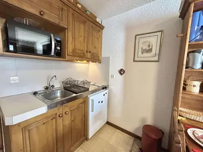 a kitchen with a sink and a microwave at Studio calme avec parking, vue montagnes, Demi-Quartier - FR-1-597-196 in Demi-Quartier