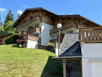 a house with balconies on the side of it at Studio calme avec parking, vue montagnes, Demi-Quartier - FR-1-597-196 in Demi-Quartier