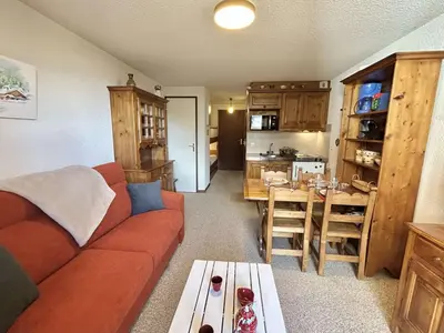 a living room with a couch and a table at Studio calme avec parking, vue montagnes, Demi-Quartier - FR-1-597-196 in Demi-Quartier