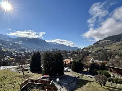 a view of a town with mountains in the background at Studio calme avec parking, vue montagnes, Demi-Quartier - FR-1-597-196 in Demi-Quartier