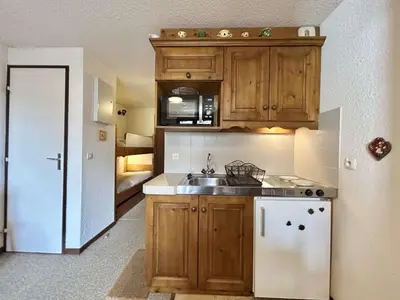 a kitchen with a sink and a refrigerator at Studio calme avec parking, vue montagnes, Demi-Quartier - FR-1-597-196 in Demi-Quartier