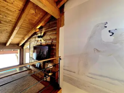 two white polar bears on the wall of a room at Chalet du Lay Côte 2000 ski in ski out in Megève