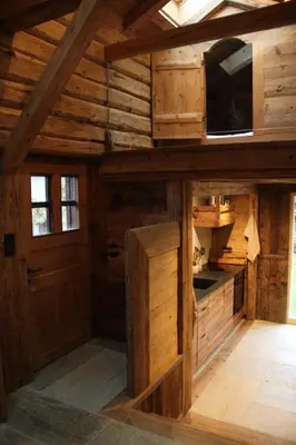 an inside view of a wooden cabin with a door at L'Ultime in Saint-Gervais-les-Bains