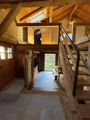 an attic room with a staircase in a house at L'Ultime in Saint-Gervais-les-Bains
