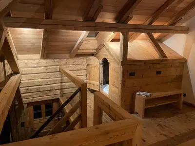 an overhead view of a wooden house with wooden stairs at L'Ultime in Saint-Gervais-les-Bains