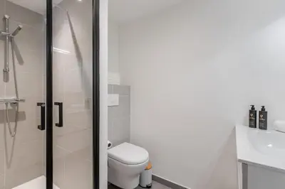 a bathroom with a toilet and a shower at Kandahar de Kayla - Proche remontée - Espace bien-être in Les Houches