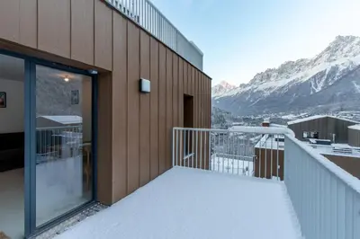 a balcony with a view of the mountains at Le Manoir de Kayla - Piscine, Sauna & Vue in Les Houches
