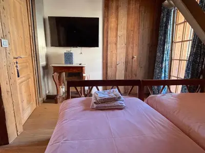 a bedroom with a bed with a towel on it at Chalet Hermine in Megève