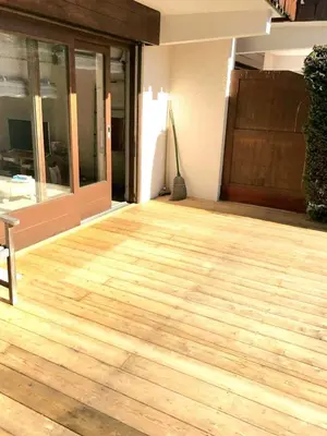 a bedroom with a large bed with a window at Apartment with large terace next Jaillet ski area in Megève