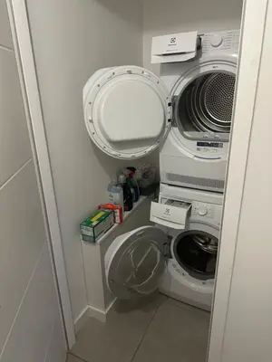 a bathroom with a washer and a washing machine at L'écrin de Samoëns in Samoëns