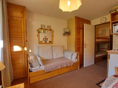 a room with a couch in a room with a mirror at Charmant studio 3 pers, vue pistes - FR-1-642-106 in Morillon