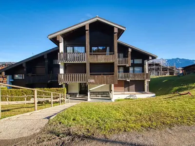 a large wooden house with a balcony on a hill at Charmant studio 3 pers, vue pistes - FR-1-642-106 in Morillon