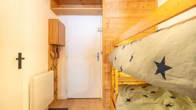 a bedroom with a bunk bed in a tiny house at Grand Tetras N111 2P6 in Morillon