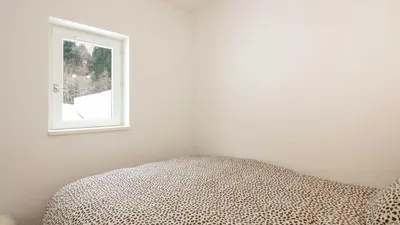 a bedroom with a bed and a window at Grand Tetras N111 2P6 in Morillon