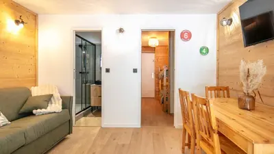 a living room with a couch and a table at Grand Tetras N111 2P6 in Morillon