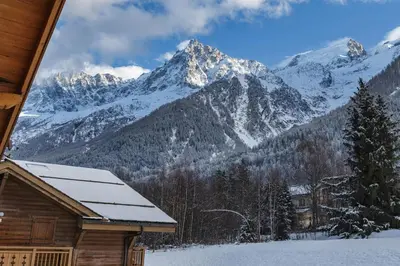 a view of a snowy mountain range from a cabin at Le Hameau des Glaciers - Ski & Vue Incroyable in Les Houches