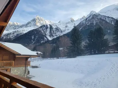 a view of a snow covered mountain from a cabin at Le Hameau des Glaciers - Ski & Vue Incroyable in Les Houches