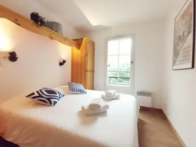 a bedroom with a white bed with towels on it at Grand Panorama in Saint-Gervais-les-Bains