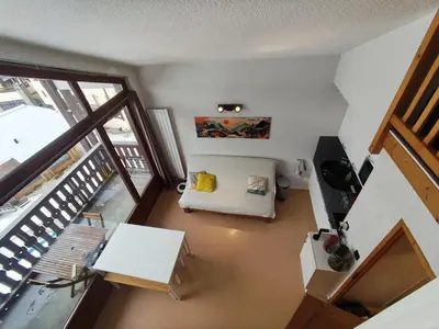 an overhead view of a living room with a balcony at Les Eterlous N44 2P6 in Morillon