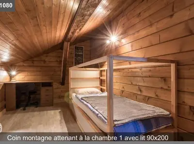 a bedroom with a bunk bed in a wooden cabin at L'Arbaz in Samoëns