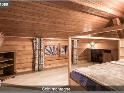 a bedroom with wooden walls and a bed in a room at L'Arbaz in Samoëns