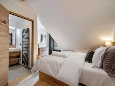 a living room with a couch and a tv at Appartement moderne Saint-Gervais 6 pers, proche remontées mécaniques - FR-1-663-58 in Saint-Gervais-les-Bains