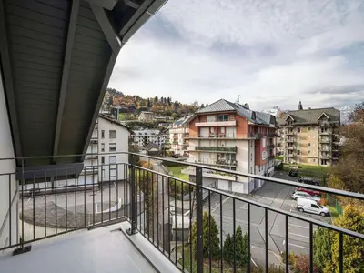 a balcony with a view of a city at Appartement moderne Saint-Gervais 6 pers, proche remontées mécaniques - FR-1-663-58 in Saint-Gervais-les-Bains