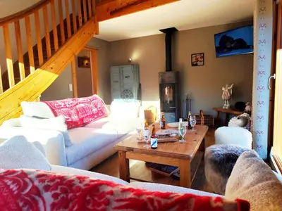 a living room with couches and a coffee table at Le Montagnard in Saint-Gervais-les-Bains